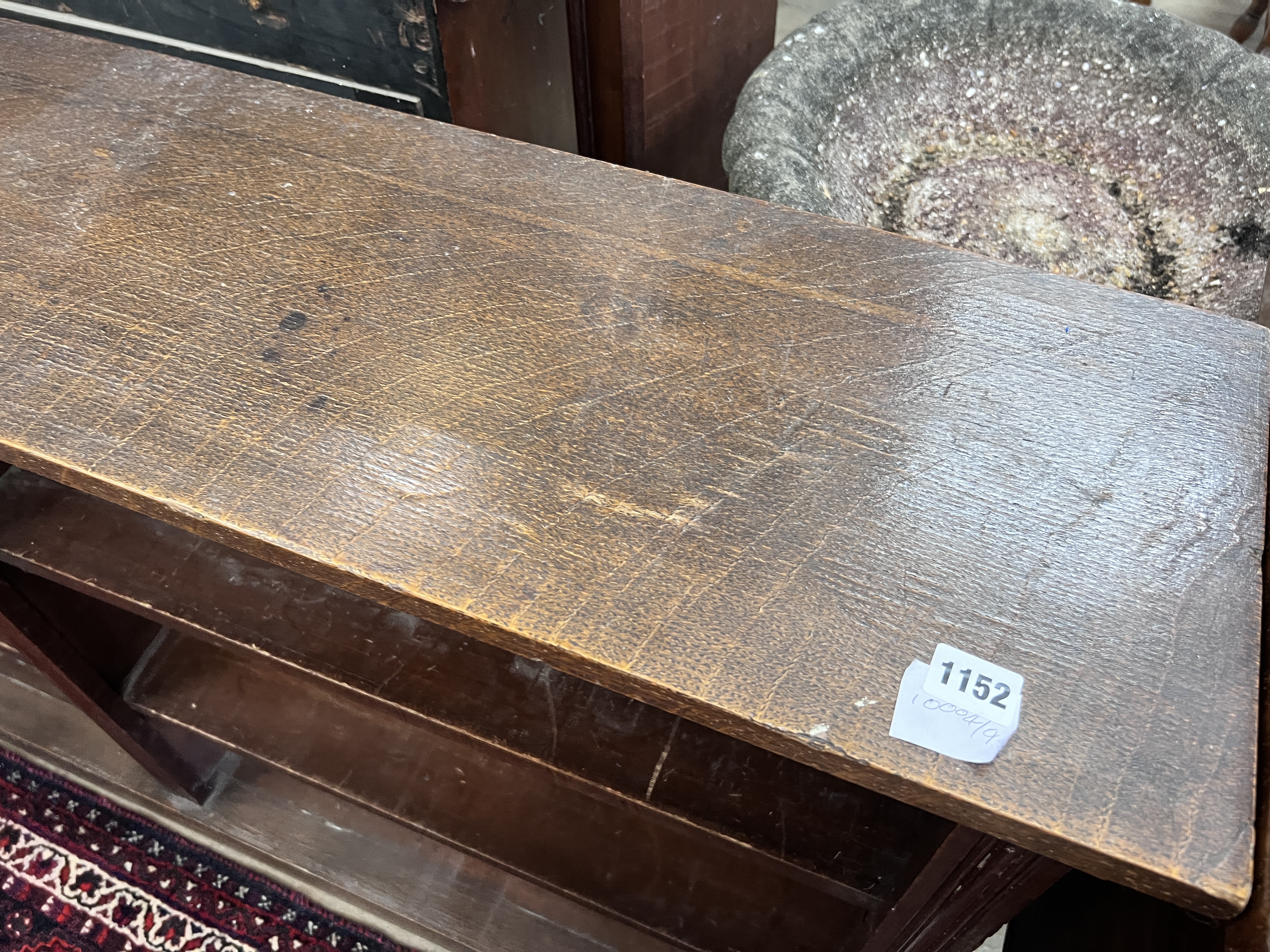 An early 20th century oak open dwarf bookcase, width 160cm, depth 28cm, height 91cm